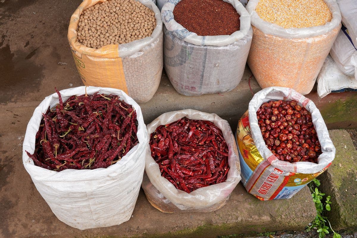 Open sacks of dried red chillies at an Indian market