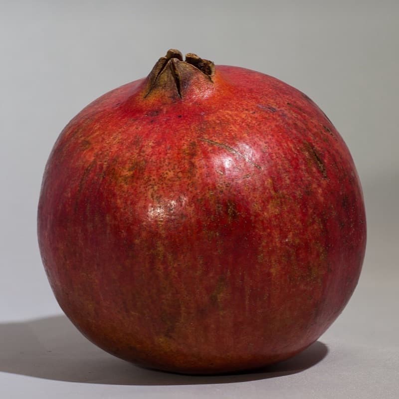 A whole fresh pomegranate